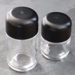 Wholesale 1 Oz 2 Oz 4 Oz 6 Oz 3.5g Customized Printed Child Proof Clear Glass Jar With Black Child Resistance Lids | Eaglebottle