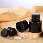 Wholesale Custom Mini 10ml 15ml 30ml Amber Clear Blue Black Glass Lip Balm Containers Cosmetic Cream Jars 5g 0.5oz Skincare Jar With Lid | Eaglebottle